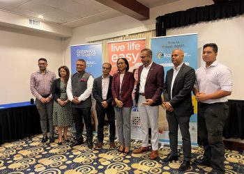 Minister of Tourism, Industry and Commerce - Hon. Oneidge Walrond (4th from right) & Mr. Salaudeen Nausrudeen (4th from left) - Founder/CEO of Kaietour.com pose for a photo opp with tourism, Government and private sector leaders who were present at the launch.
