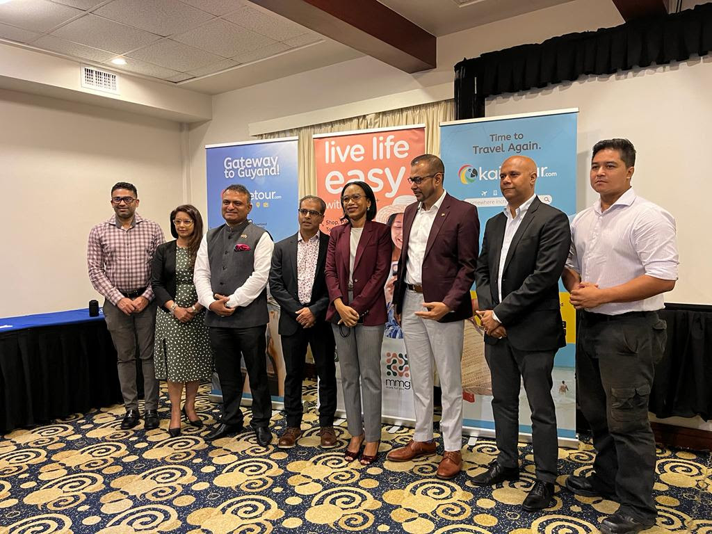Minister of Tourism, Industry and Commerce - Hon. Oneidge Walrond (4th from right) & Mr. Salaudeen Nausrudeen (4th from left) - Founder/CEO of Kaietour.com pose for a photo opp with tourism, Government and private sector leaders who were present at the launch.