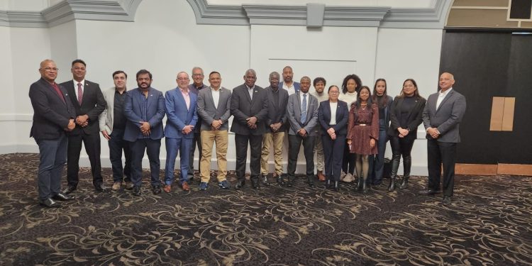 Pix shows Energy Minister Vickram Bharrat and Home Affairs Minister Robeson Benn at Energy Conference in Toronto. They interacted with the Guyanese diaspora.