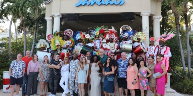 Radio Personalities are shown with the Junkanoo group at a farewell event at Sandals Emerald Bay, Exuma