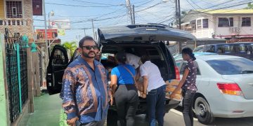 Dave Narine distributes bread and other necessities to depressed communities in Guyana