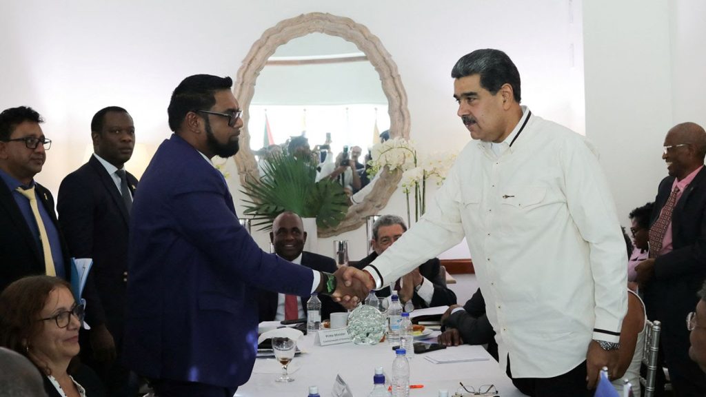 Guyanese President Irfaan Ali and Venezuela's President Nicolas Maduro shake hands as they meet amid tensions over a border dispute, in Kingstown, St. Vincent and the Grenadines, on December 14, 20223.