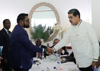 Guyanese President Irfaan Ali and Venezuela's President Nicolas Maduro shake hands as they meet amid tensions over a border dispute, in Kingstown, St. Vincent and the Grenadines, on December 14, 20223.