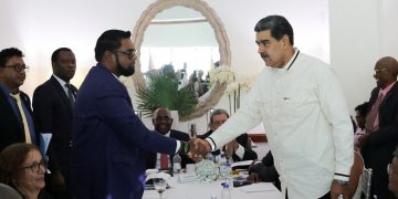 Guyanese President Irfaan Ali and Venezuela's President Nicolas Maduro shake hands as they meet amid tensions over a border dispute, in Kingstown, St. Vincent and the Grenadines, on December 14, 20223.