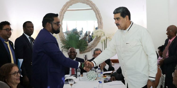 Guyanese President Irfaan Ali and Venezuela's President Nicolas Maduro shake hands as they meet amid tensions over a border dispute, in Kingstown, St. Vincent and the Grenadines, on December 14, 20223.