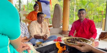 (File Pix - Ramdeen, left) and Pt. Nitin performing havan)