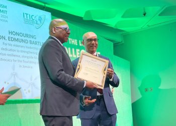 Pictured: Minister of Tourism, Hon. Edmund Bartlett (L) collects his ITIC award for his work in Sustainability and Resilience in Tourism at the ITIC Global Tourism Summit on Monday, November 4, from Ibrahim Ayoub, Group CEO, MD and Board Member of International Tourism Investment Corporation Ltd.