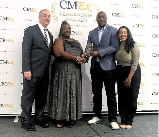 PS in the Ministry of Tourism, Mr. Wesley Clerveaux presents Ms. Laura Dowrich-Phillips Ali with her CMEx Leadership Award along with CMEx founder Mr. Bevan Springer and event host Ms. Vanessa James